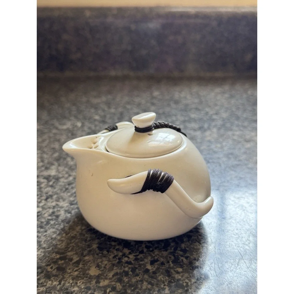 Compact travel tea pot white ceramic with decorative cord